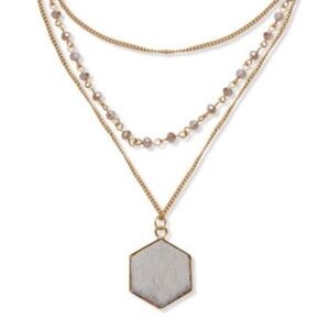 Triple strand golden necklace, leather pendant